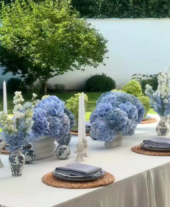 Blue hydrangeas and blue-and-white porcelain on white linen